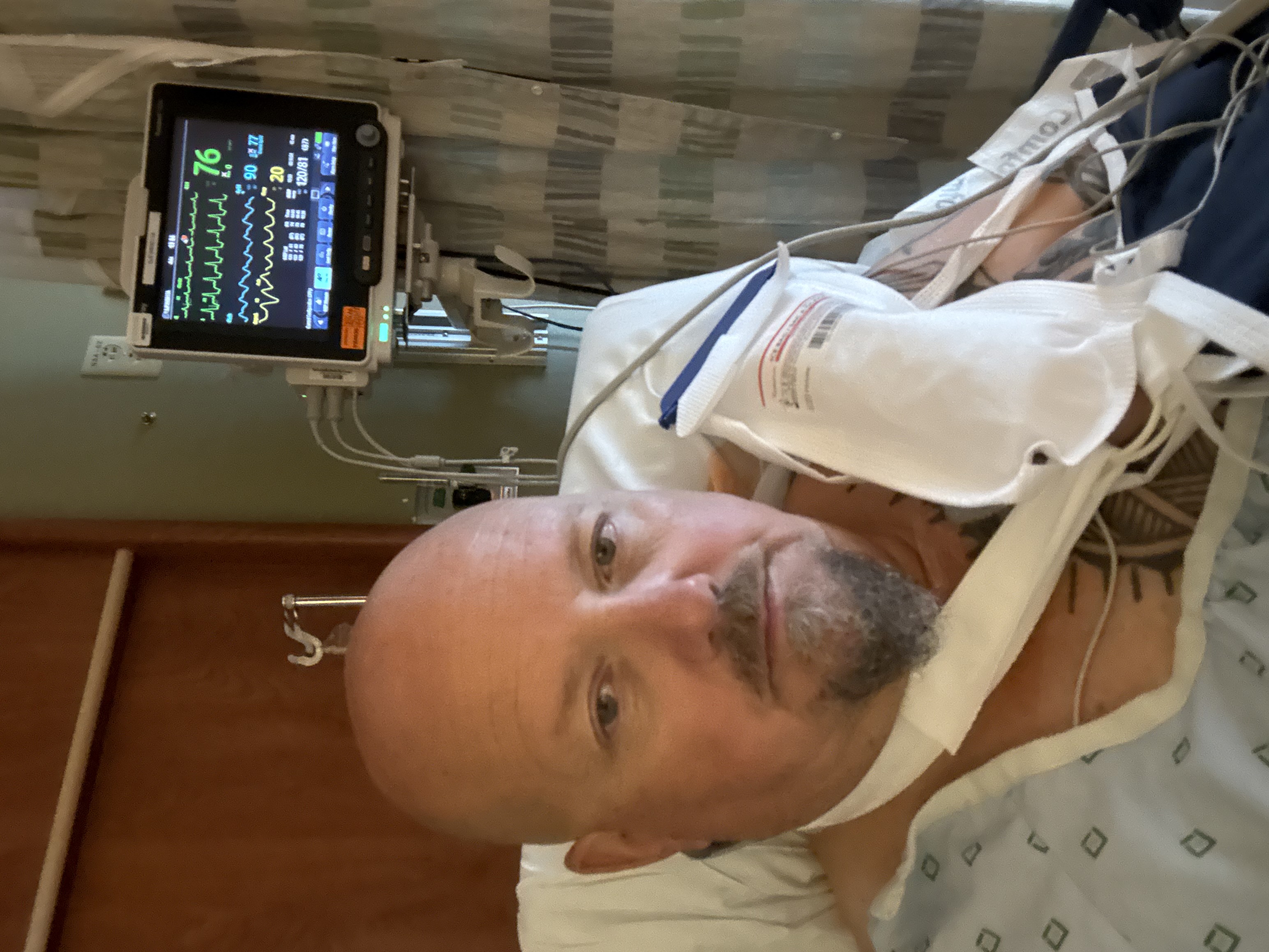 Ewan resting in a hospital bed